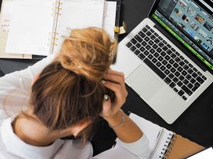 Woman Frustrated Working on Laptop